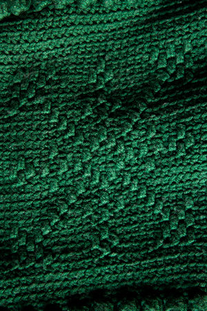 close-up texture green crocheted or knitted blanket with a snowflake pattern, backgroundの写真素材