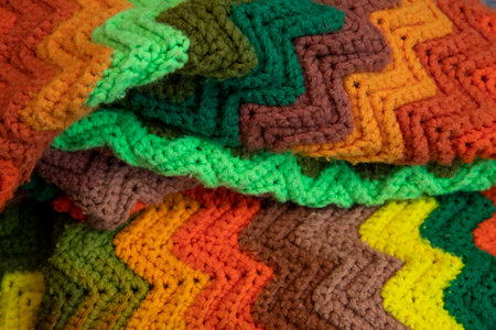 close-up of grandma's retro zigzag striped blanket, crocheted or knitted, grandma's house, cozy and...