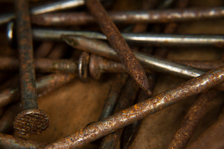old rusty, 16 penny nails, pile of heavy penny nails for construction and carpentry, building, creating, antique, old, grandfathers building toolsの写真素材