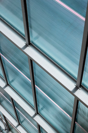 perspective of roof for indoor swimming pool with blue tint and metal beams architecture engineering