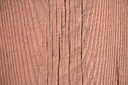 close up of peeling old peach pink pine wood grain with copy space, top view, wooden bench close-upの写真素材