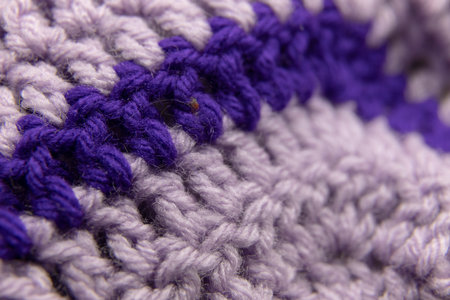 close-up of grandma's lilac purple blanket and royal purple blanket, crocheted or knitted, grandma's house, cozy and warm, macro backgroundの写真素材