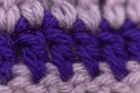 close-up of horizontal crochet stitches in royal purple with lilac purple stitches, crocheted or...