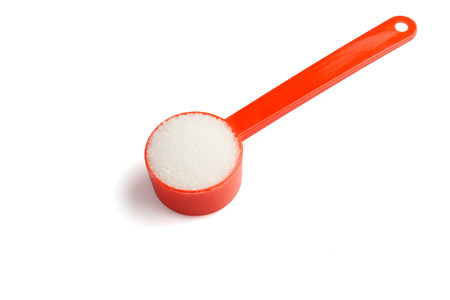 Sugar stack in a measuring spoonの写真素材