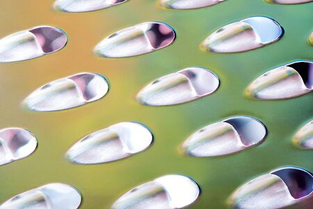 Extreme macro close up of a cheese graterの写真素材