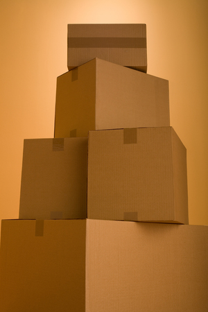 Boxes in an empty room representing concept of home movingの写真素材