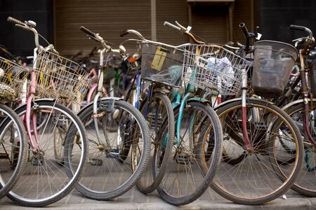 Bicycles at a parking zone in downtown Shanghai, China, Asiaの写真素材
