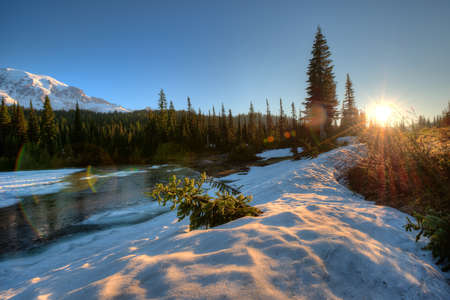Frozen Reflection Lake at sunrise, Mount Rainier National Park, Washington State, USAの写真素材