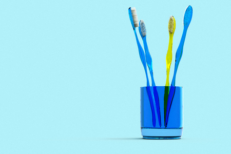 3D rendering of a group of toothbrushes in a glass.の写真素材