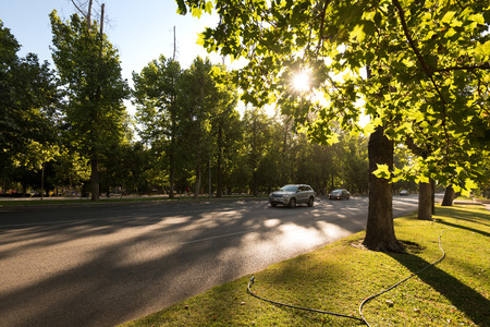 Santiago, Region Metropolitana, Chile - December 11, 2018: Traffic in the Forestal Park at downtown with a setting sun.のeditorial素材