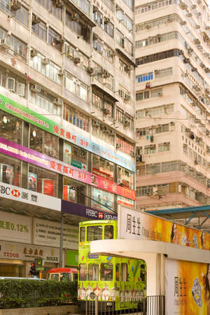Causeway Bay, Hong Kong Island, Hong Kong, China - Traditional tram and store signs in a street view.のeditorial素材