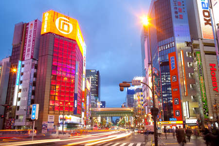 Akihabara Electric Town, Tokyo, Kanto Region, Honshu, Japan - Advertising billboards and traffic and light trails at the bustling neighborhood of Akihabara Electric Town.のeditorial素材