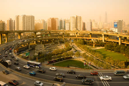 Shanghai, China, Asia - Traffic at the Access / Exit ramp to to Nanpu Bridge and city skyline.