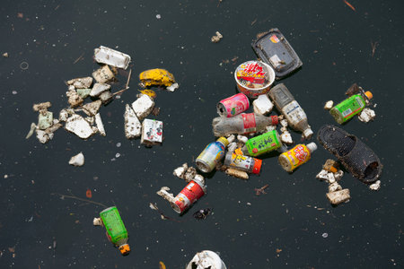 Shiodome Area, Shimbashi, Tokyo, Japan, Asia - Trash on a river in Shimbashi, Tokyoのeditorial素材