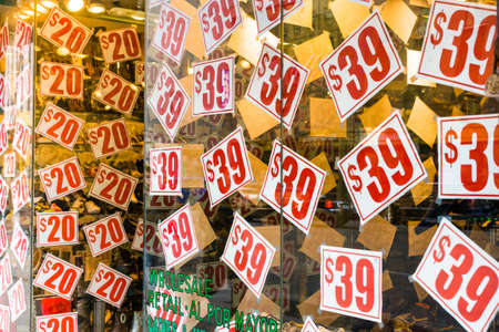 Manhattan, New York City, NY, United States - A pattern of price tags of a sale in a store in New York City.のeditorial素材