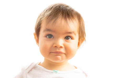 Close-up of a 1 year old baby girl with a Surprised face expressionの写真素材
