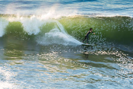 Pichilemu, Region de O'Higgins, Chile - Surfer at Punta de Lobos a surfing beach at the south of...