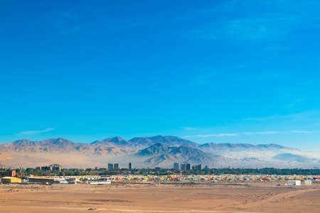 Aerial view of the mining city of Calama in northern Chile with Chuquicamata copper mine in the back.の写真素材
