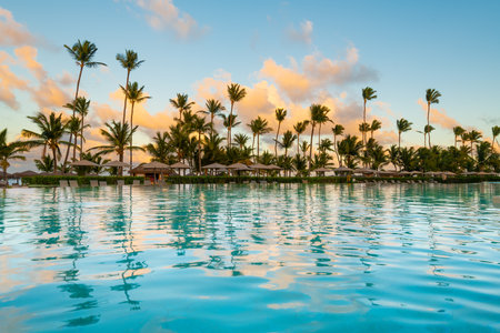 Swimming pool and palm trees in luxury resort at Pun Cana in the Dominican Republicの写真素材