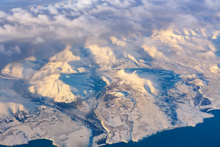 Aerial view of frozen mountains and rivers in the North Poleの写真素材