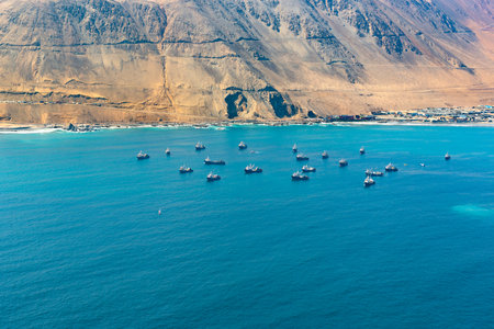 Aerial view of fishing boats in the coasts of Iquique, Chileの写真素材