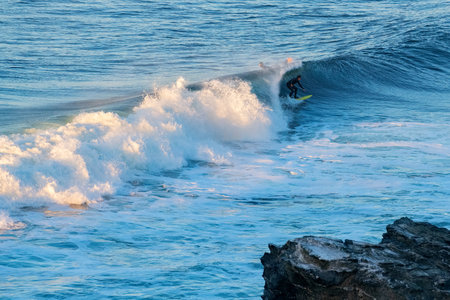 Surfer at Punta de Lobos a surfing beach at the south of Pichilemu, Pichilemu, Region de O'Higgins, Chileの写真素材