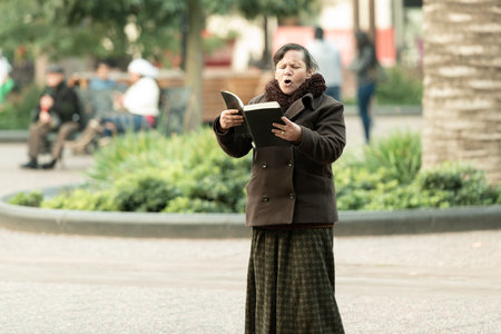 Santiago, Chile - June 06, 2016: A lonely preacher loudly shouting the word of god at the Plaza de Armas.のeditorial素材