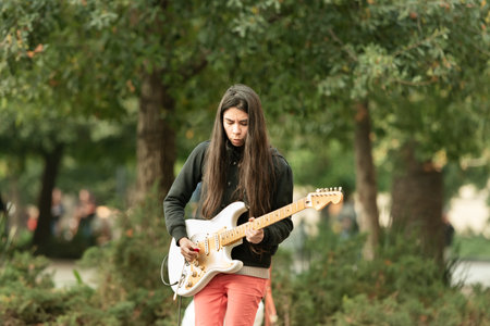 Santiago, Chile - June 06, 2016: A street musician playing electric guitar at the Plaza de Armas.のeditorial素材