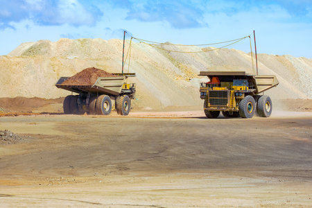 Huge large dump trucks at an open-pit copper mine in Chile.の写真素材