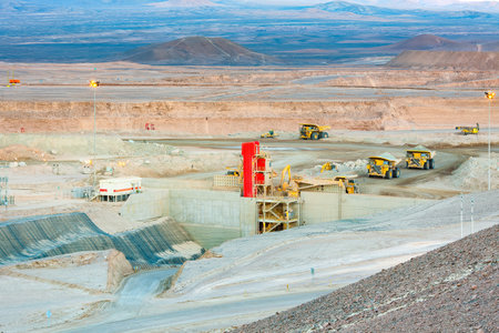 Huge large dump trucks at an open-pit copper mine in Chile.の写真素材