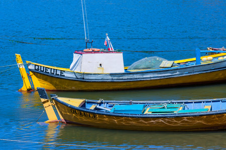 Fishing boats at Southern Chile at a small village named Queule, Chile, South Americaの写真素材