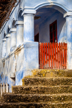 Color picture of a countryside blue painted house entranceの写真素材