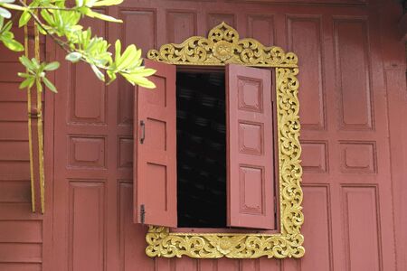 A beautiful window of a monk residenceの写真素材