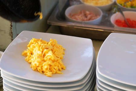 Fried eggs served in a white plate at a restaurant