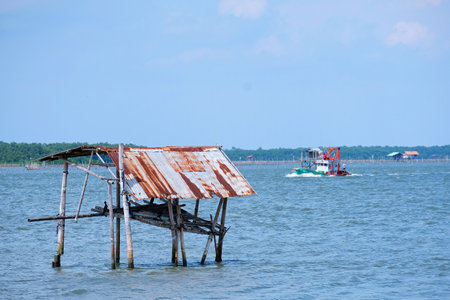 Recently, I drove my car to visit a bay in rural area. Then I took many pictures of what I have seen, for instance, fishing, fisherman, boat, clear blue sky, cloud, water tree.の写真素材