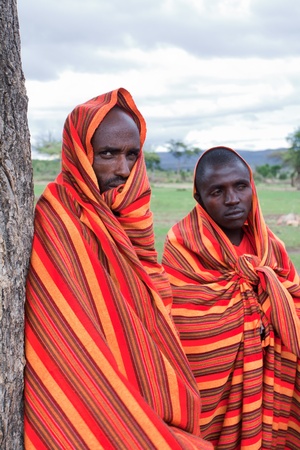 Masai Mara, Kenya - December 28, 2009: Two unidentified African men pose for a portrait on December 28, 2009 in Masai Mara, Kenya. The Masai are a Nilotic ethnic group of semi-nomadic people located in Kenya and Tanzania. のeditorial素材