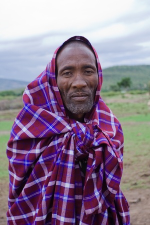 Masai Mara, Kenya - December 28, 2009: An unidentified African man poses for a portrait on December 28, 2009 in Masai Mara, Kenya. The Masai are a Nilotic ethnic group of semi-nomadic people located in Kenya and Tanzania. のeditorial素材