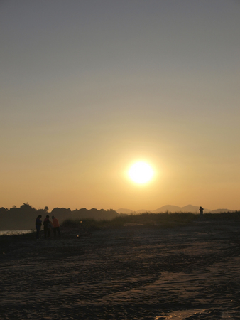 sunset at the sand bar- island of Mekong riverの写真素材