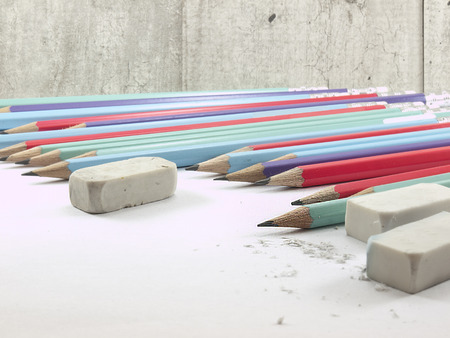 The writing tools on concrete wall background