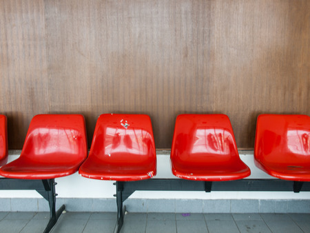The row of red chairs in the airportの写真素材