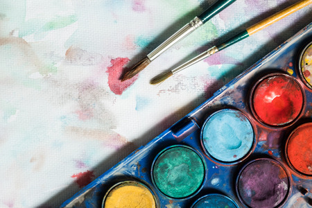 Watercolor and paintbrush painting on the white canvas background.の写真素材