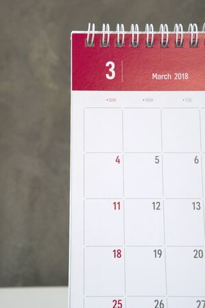 White and red march calendar on wall with cement wall.の写真素材