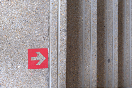 Red arrow pointing up and down a ladder.