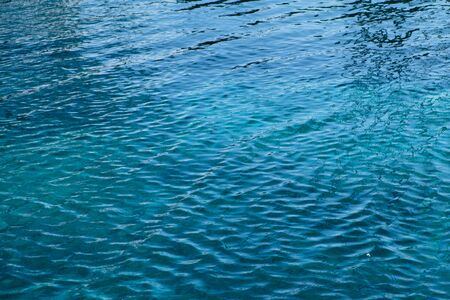 The sea breeze blows, causing the water to rattle the waves.