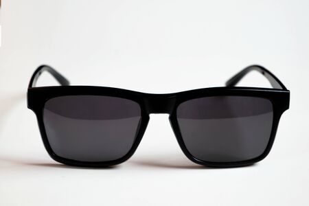 Black sunglasses, black frame isolated on a white clean background.の写真素材