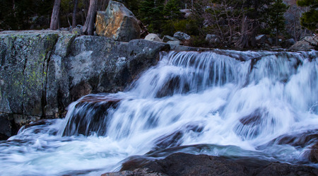 White frothing water as it flows rapidly downward.の写真素材
