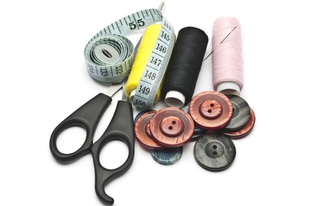 Thread, scissors, buttons, and a centimeter - sewing accessories.