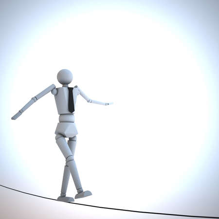 Businessman in equilibrium on a ropeの写真素材