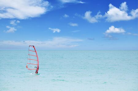 Unrecognizable person practicing windsurfの写真素材