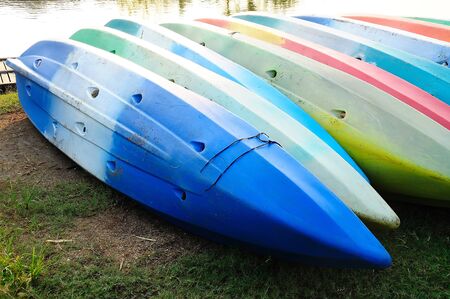 Colorful kayaks in stack